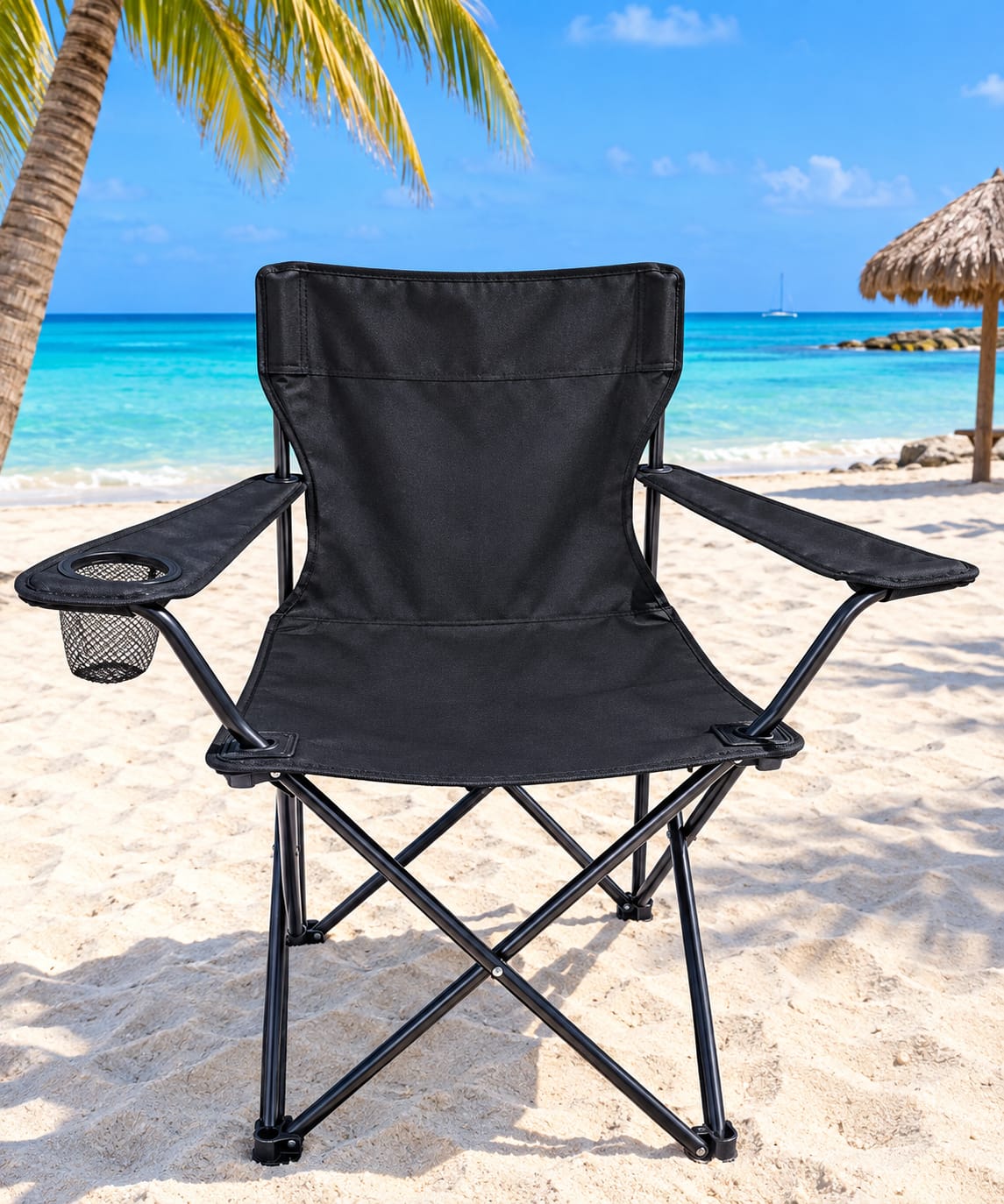Black beach chair on the sand